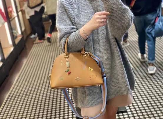 Coach Katy Satchel with Diary Embroidery (Category: Luxury Bags & Wallets) located in Mandaluyong City. Submitted by shop_0n_the_spot (Listing ID 1163682995, Image 1). Description: Coach Katy Satchel with Diary Embroidery Product Details • Refined pebble leather and smooth leather • Inside zip pocket • Zip closure, fabric lining • Handles with 3 3/4" drop • Outside zip pocket • Detachable strap with 22" drop for shoulder or crossbody wear • Four 