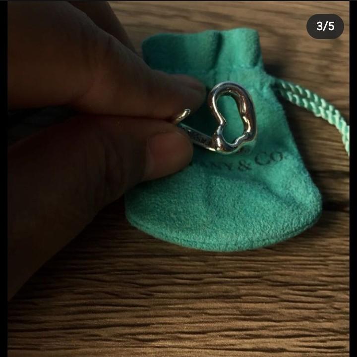 Authentic Tiffany open heart ring. Size 6. Selling low at Php3600. No meet ups (Category: Rings) located in Paranaque City. Submitted by closetisfullbackup (Listing ID 1163696006, Image 3). Description: - Excellent used condition, comes with pouch only - sourced in Japan.