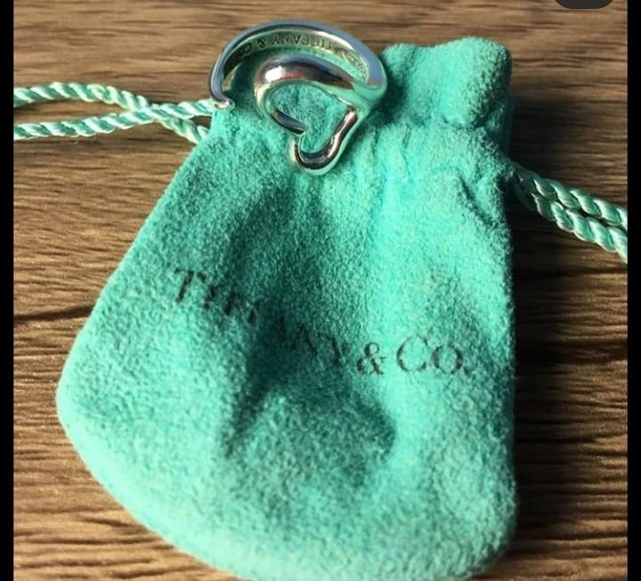 Authentic Tiffany open heart ring. Size 6. Selling low at Php3600. No meet ups (Category: Rings) located in Paranaque City. Submitted by closetisfullbackup (Listing ID 1163696006, Image 1). Description: - Excellent used condition, comes with pouch only - sourced in Japan.