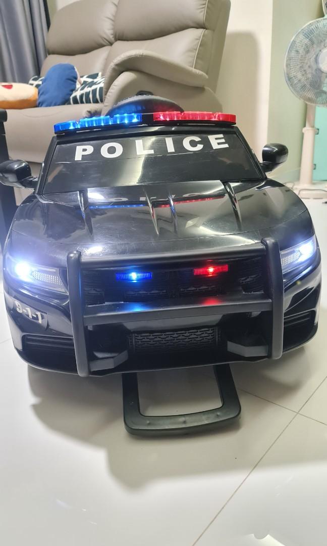 Remote control police car with working lights and siren top