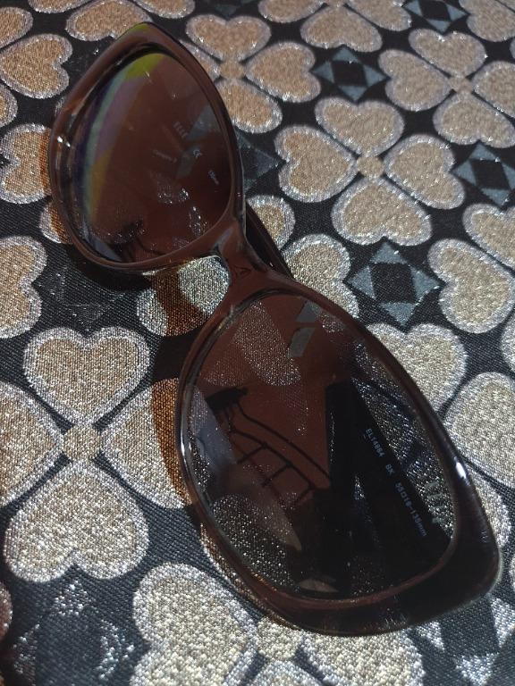 ELLE Sunglasses for Women (Category: Vision Care) located in Baguio. Submitted by formorecravings (Listing ID 1163810061, Image 1). Description: New without tags. Comes with its original protective case, care card, and lens cloth. Frame Color: Black Lens Color: Blue Eyewear Size: M Item description based on barcode is black frame color but actual has a bit of brown shade. Lens color is a shade of light blue/black. Kindly manage expectations. Plea