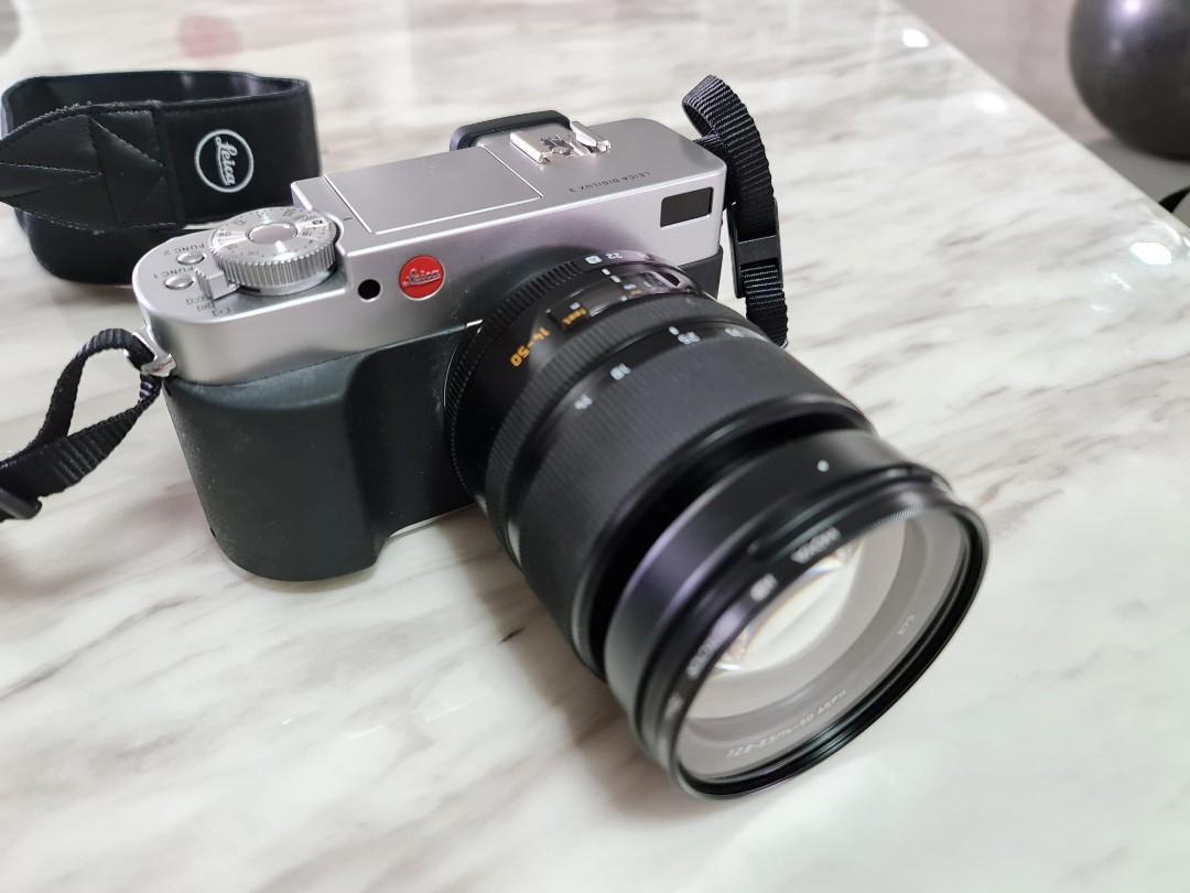 Leica Digilux 3 SLR camera with 14-50mm f2.8-3.5 Leica D Vario-Elmarit lens  and accessories