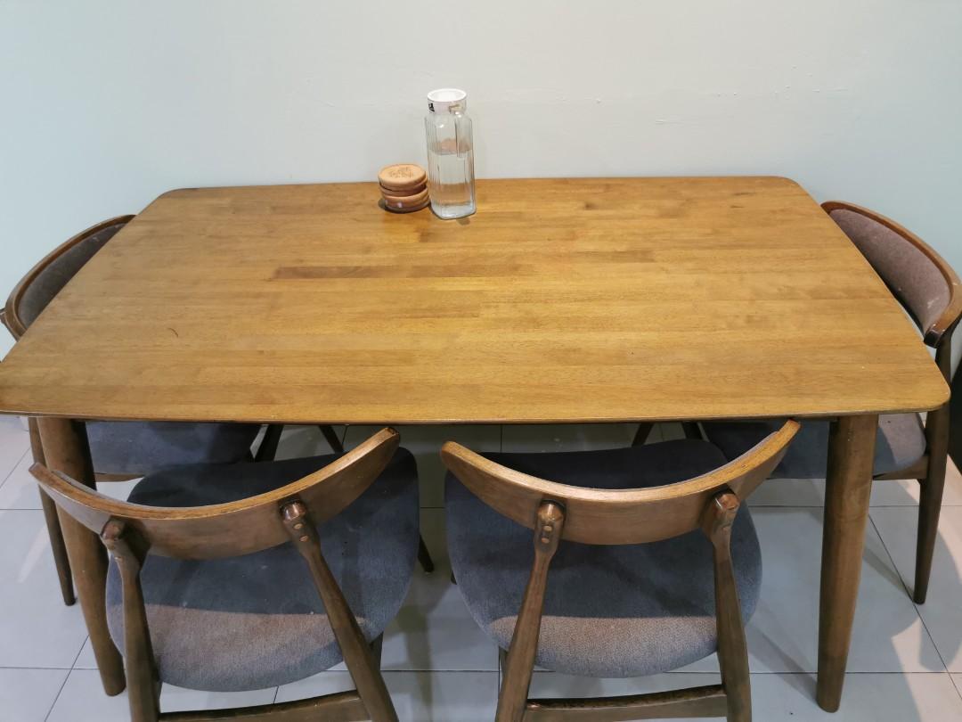 Dining Table (Category: Tables & Sets) located in Singapore. Submitted by prk07 (Listing ID 1159302407, Image 1). Description: Wooden dining table with 5 chairs..heavily used but still strong!! Dimension : 140(L) X 80(W) X 70(H) Arrange for own delivery.. Location: Yew Tee(682683).