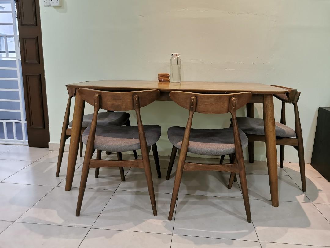 Dining Table (Category: Tables & Sets) located in Singapore. Submitted by prk07 (Listing ID 1159302407, Image 2). Description: Wooden dining table with 5 chairs..heavily used but still strong!! Dimension : 140(L) X 80(W) X 70(H) Arrange for own delivery.. Location: Yew Tee(682683).