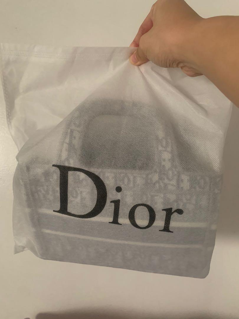 Grey Dior mini book tote (Category: Luxury Bags & Wallets) located in San Mateo. Submitted by michelleocruz (Listing ID 1159560486, Image 3). Description: Japan source. Used twice. Pre-loved. Like new. Lalamove / Shipping fee - shouldered by the buyer Gcash or bank transfer - payment Rfs: too small for me.