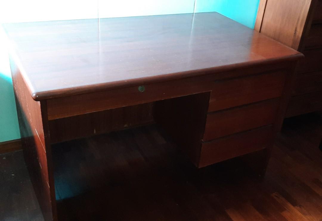 Study table (Category: Tables & Sets) located in Singapore. Submitted by erictham0927 (Listing ID 1159438977, Image 3). Description: old study table. drawers all in gd working condition. no scratches. L 120 H 77 W 73 cm. Arrange your transport.