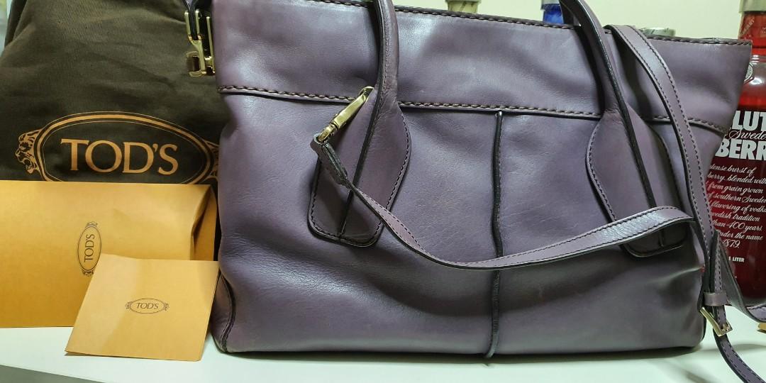 *Clearance Sale!* Authentic Tod's D Bag (Category: Bags & Wallets) located in Singapore. Submitted by yvo2405 (Listing ID 1159734322, Image 1). Description: Authentic Tod's D Bag in purple color Detachable shoulder strap and can carry crossbody Good shopping bag, big n very spacious, can fit A4 documents nicely Scuffing can be seen at bottom of bag near the metal feet, but not obvious when bag is carried Bag is rarely used and interior is very cl