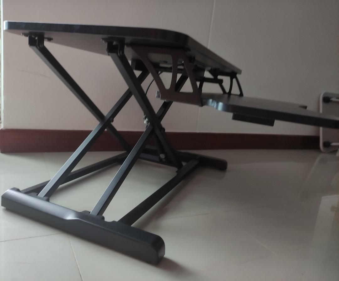 Extendable Computer Table (Category: Tables & Sets) located in Singapore. Submitted by omelettefart (Listing ID 1165848501, Image 3). Description: Tried it for a day, so as good as new. Still have the box and all the original things inside. 1. Can be put on top of tables. 2. Can extend the height of the table to match your needs..