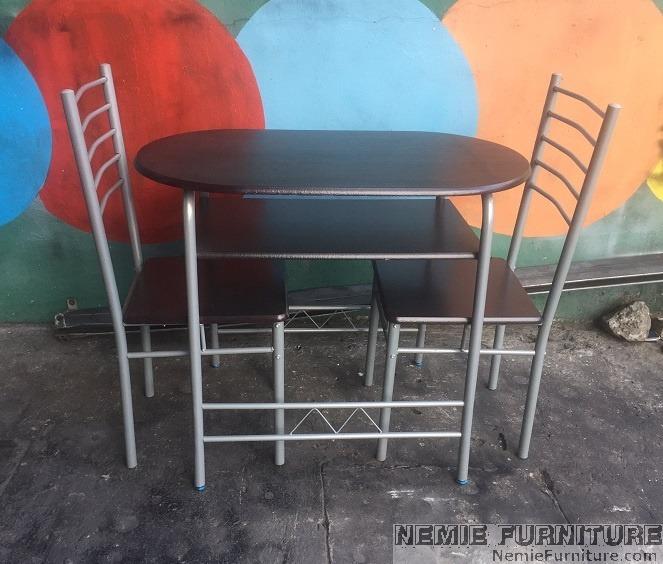 JIT2123 breakfast set / dining table with 2 chairs (Category: Tables & Sets) located in Quezon City. Submitted by nemiefurniture (Listing ID 1165860670, Image 1). Description: oval table with 2 chairs table: 35.5"L x 20"W x 29"H chair: 15"L x 15.5"W x 35.5"H color: wenge table top and top seat with gray metal frame https://nemiefurniture.com Prices negotiable .