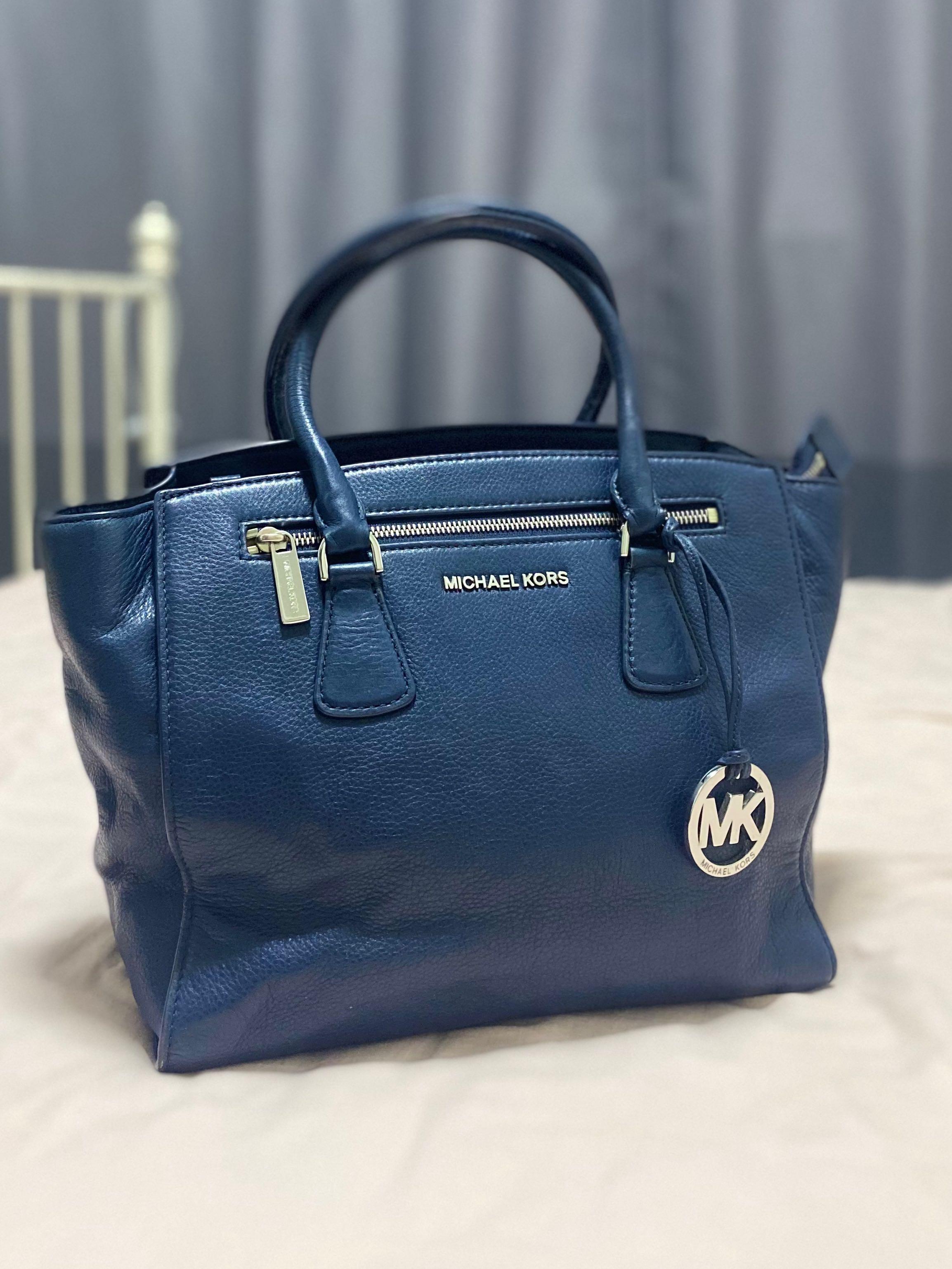 Lot 1111  A Michael Kors navy blue leather handbag