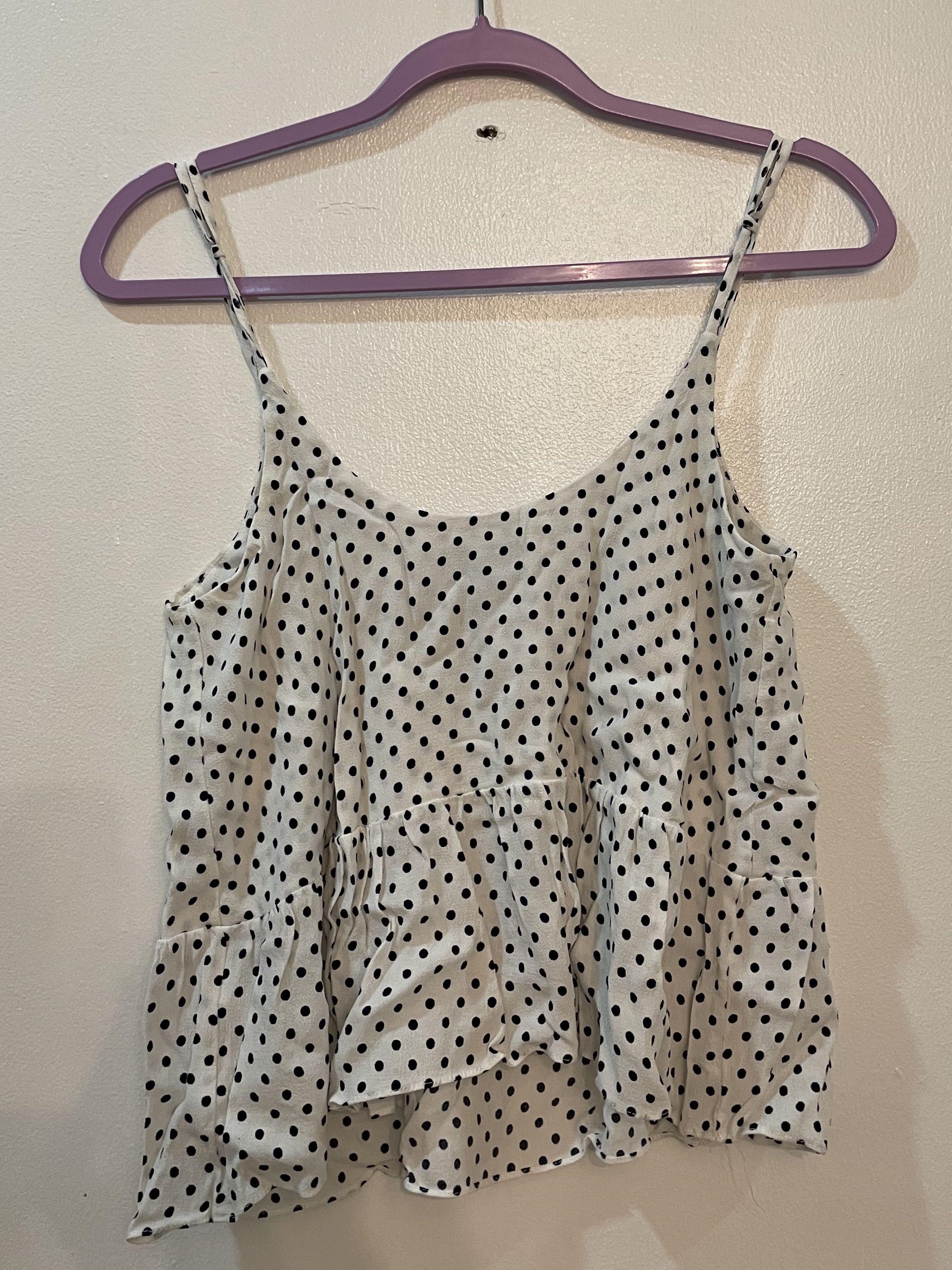 Topshop polka dotted tank top (Category: Sleeveless) located in Quezon City. Submitted by caradejesus (Listing ID 1165955195, Image 3). Description: Not cropped, but it feels like it because the bottom of the top is loose and flowy Best worn with shorts or skinny jeans.