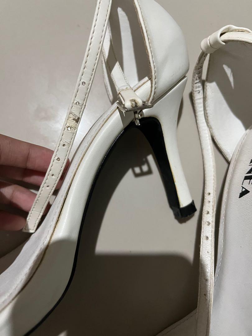 White heels (Category: Heels) located in Cebu City. Submitted by minymal (Listing ID 1165933803, Image 2). Description: Used twice. Stored with box. Please see close up photos. Size 5.