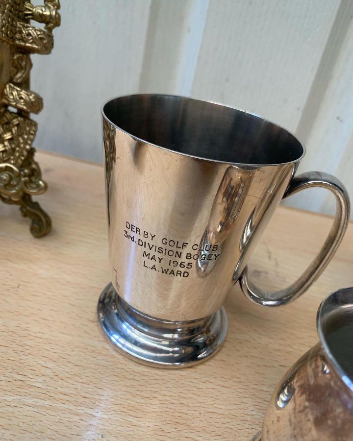 Assorted Vintage Tankards set (Category: Coffee & Tea Tableware) located in Pasig City. Submitted by colawire (Listing ID 1166030817, Image 2). Description: Tankards Left- Der by Golf Club 3rd division Bogey May 1965 L.A. Ward Php280 Center Silver plated Made in England Php140 Right Chester Silver plate ERO 1953 Made in England Php380 Take all- 590.