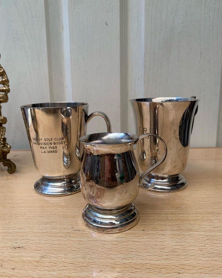 Assorted Vintage Tankards set (Category: Coffee & Tea Tableware) located in Pasig City. Submitted by colawire (Listing ID 1166030817, Image 1). Description: Tankards Left- Der by Golf Club 3rd division Bogey May 1965 L.A. Ward Php280 Center Silver plated Made in England Php140 Right Chester Silver plate ERO 1953 Made in England Php380 Take all- 590.