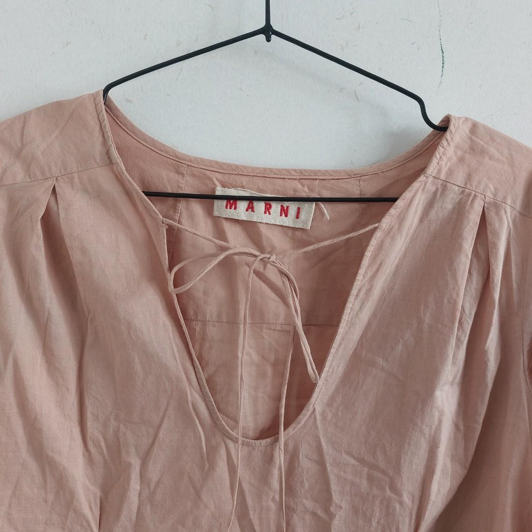 Marni Light Pink Blouse (Category: Blouses) located in Angeles City. Submitted by greensstuff (Listing ID 1166024325, Image 2). Description: B: 35" Has some writing on the hem of the sleeve as seen in the 4th photo. It's been washed but I just noticed the writing but in otherwise good condition. Fabric is very lightweight. I bought through an IG shop for 700 pesos. DM for more info #4theplanet.