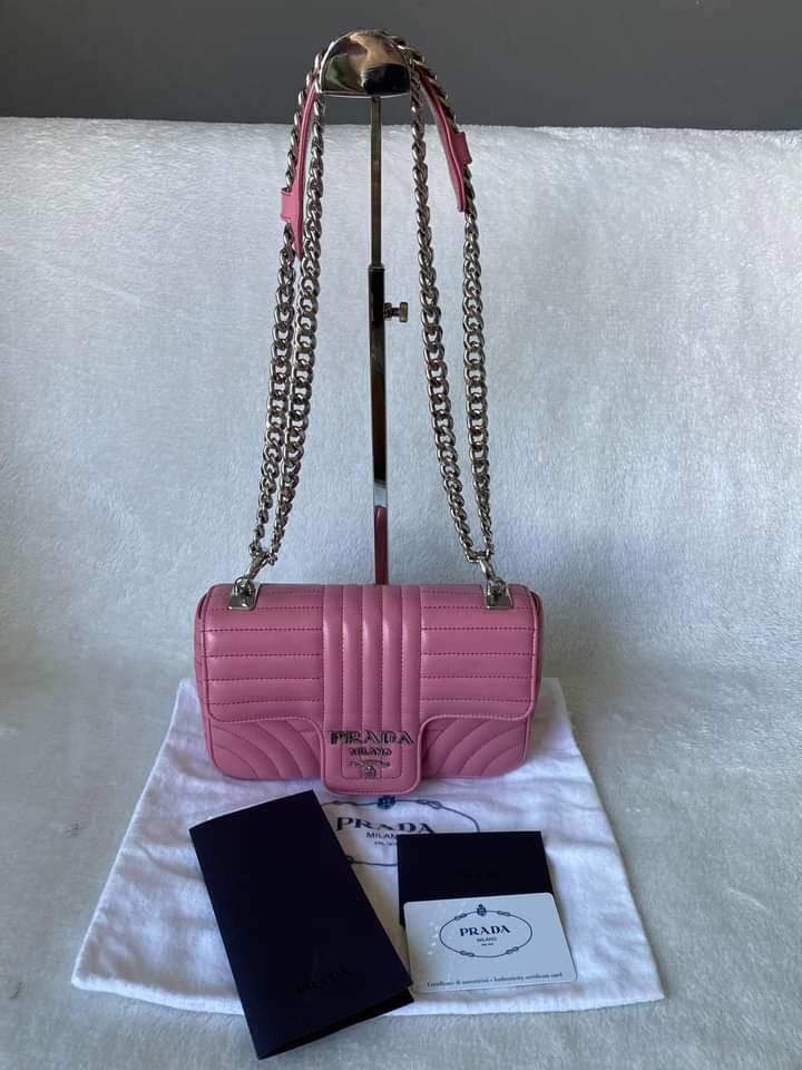 Prada 1B107 Diagramme Flap Chain Bag (Category: Luxury Bags & Wallets) located in Manila. Submitted by bagislifeshop (Listing ID 1166282042, Image 1). Description: ▪️Prada 1B107 Diagramme flap chain bag▪️ ☑️In transit to Manila ✅Condition: 8.8/10 ✅Material: Soft calf leather ✅Dimension: L21 H16 W5cm ✅Colour: Begonia pink in SHW ✅Inclusions: Dust bag, authenticity card, booklet and receipt ✅Purchase price: SGD2,460.