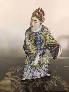 Antique old porcelain statue