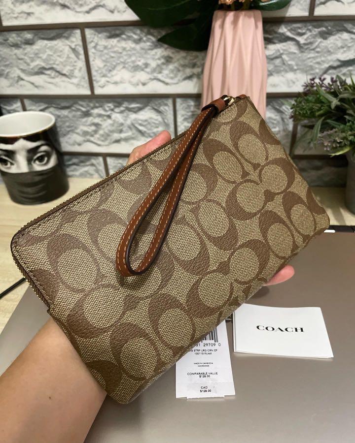 coach large corner zip wristlet (Category: Wallets & Card holders) located in Makati City. Submitted by mylittlechicshop (Listing ID 1167170633, Image 3). Description: Large Corner Zip Wristlet in signature Canvas ✅1 pc only 3,500 only Signature coated canvas and smooth leather Two credit card slots Zip closure fabric lining Wrist strap attached 7 3/4 (L) x 4 3/4 (H) x 1/2 (W) fits large phones 💯guaranteed original from 🇺🇸 on hand and ready to