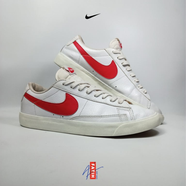 red tick nike trainers