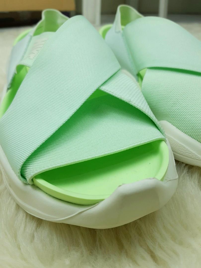 Nike Praktisk Sandals (Category: Flats & Sandals) located in Quezon City. Submitted by darkermatter (Listing ID 1167429759, Image 2). Description: Barely Green/Sail-Barely Volt Bought this for my mom. Sinukat lang. She doesn't like the color. Threw the box away. size: W8.