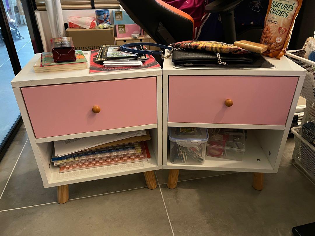 Bedside table (Category: Tables & Sets) located in Singapore. Submitted by moohippomoo (Listing ID 1167682272, Image 2). Description: One drawer left! The one that has minor defects is left. Please see photos for measurements. Approx measurements are: Width 41 cm Depth 31cm Height 49cm White bedside table with pink drawers. Can be used as a small coffee table or anywhere around your home. We used it to store kids books and stuff in the living roo