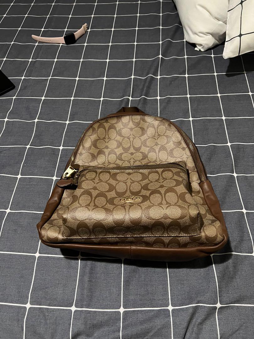 Coach Charlie Backpack in Khaki (Medium) (Category: Luxury Bags & Wallets) located in Del Monte. Submitted by _querencia (Listing ID 1168211130, Image 2). Description: Bought from the US Issue: Visible scratches on the lower back leather part of the bag .