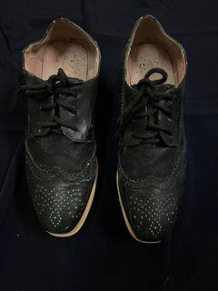 Black leather shoe