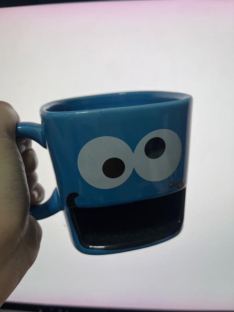 Cookie Monster Mug with Cookie Holder (Category: Coffee & Tea Tableware) located in Makati City. Submitted by darlenesamson2 (Listing ID 1168291340, Image 1). Description: Bought in Universal Studios Japan in 2016. Never used. Rare mug. Sesame Street..