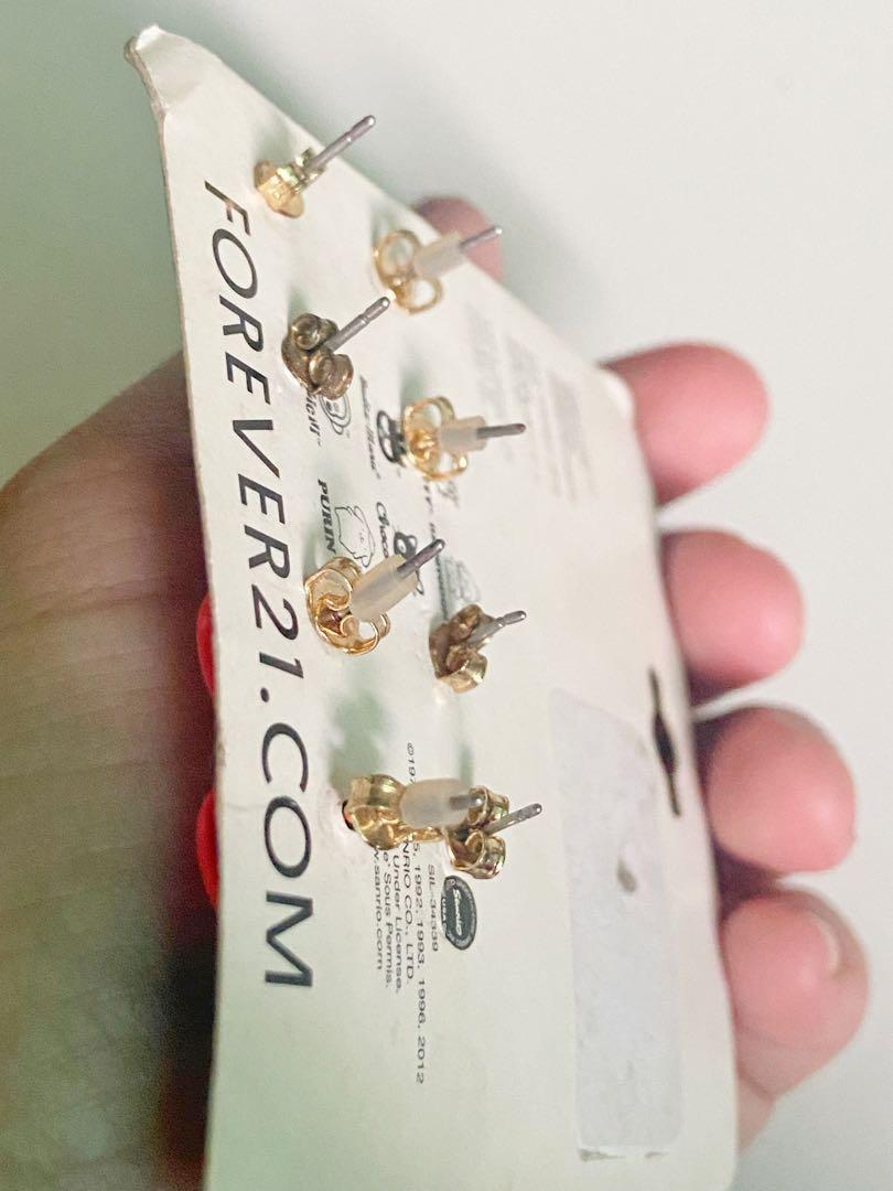 Hello Kitty Earrings Forever 21 Exclusive Collection (Category: Earrings) located in Makati City. Submitted by raket_era.333 (Listing ID 1168322576, Image 3). Description: Hello Kitty Earrings Forever 21 Exclusive Collection used the gold bow and black pretzel earrings (may tarnish ang pakaw) 👉🏻 swipe left for more detailed pics 👉🏻 no offer means no reservation 👉🏻 Please don’t make an offer and promise if you’re not 100% sure to get the ite