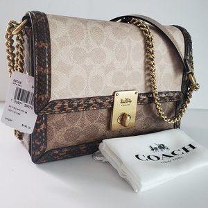 Hutton shoulder bag in blocked signature canvas with snakeskin detail discount