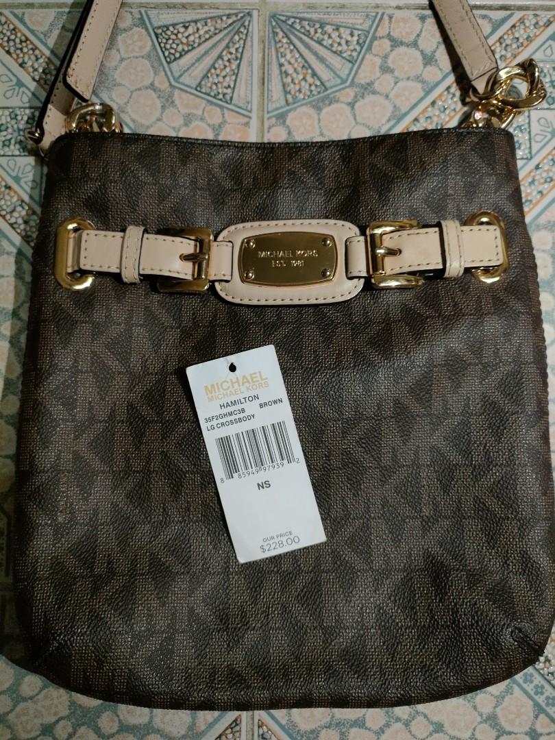 Michael Kors Hamilton Crossbody Bag (Category: Luxury Bags & Wallets) located in Bacoor. Submitted by aneworr (Listing ID 1168808339, Image 1). Description: 100% GUARANTEED ORIGINAL MICHAEL KORS (from USA) HAMILTON LG CROSSBODY BAG BROWN COLOR Bought for USD228 No issues Almost new, bagong bago, minsan lang nagamit when travelling abroad. RFS: Di nagagamit, sayang nakatago lang..