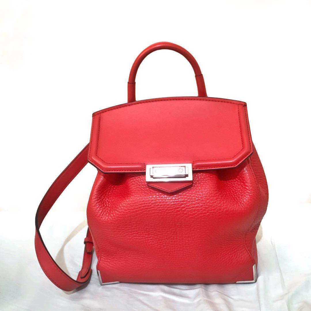 Authentic Alexander Wang Red Leather Prisma Backpack (Category: Luxury Bags & Wallets) located in Makati City. Submitted by random.objects (Listing ID 1168870374, Image 1). Description: Authentic Alexander Wang Red Leather Prisma Skeletal Mini Backpack - Red pebbled leather body, smooth leather flap - Hidden pocket at the back (photo 3), pocket inside (photo 4) - With top handle and adjustable straps (photo 5) - Fully lined - Retails for $800+ / 