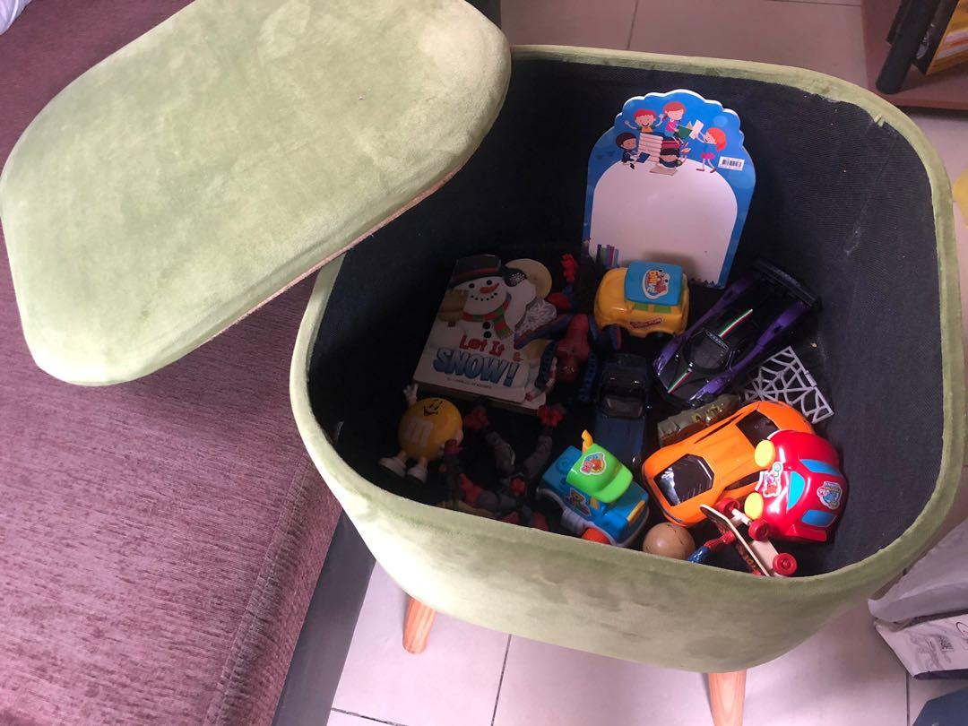 Accent Ottoman Storage Stool with broken cover (Category: Chairs) located in Quezon City. Submitted by lots2love (Listing ID 1164485700, Image 3). Description: Accent Ottoman Storage Stool with broken cover - Color: Light Green - Materials: Velvet fabric upholstery, wooden feet - Used only as toy storage for my nephew who seldom visits - Issue: Inner board of top cover got broken (cracked on one side) when a heavy built adult sat on it with only 