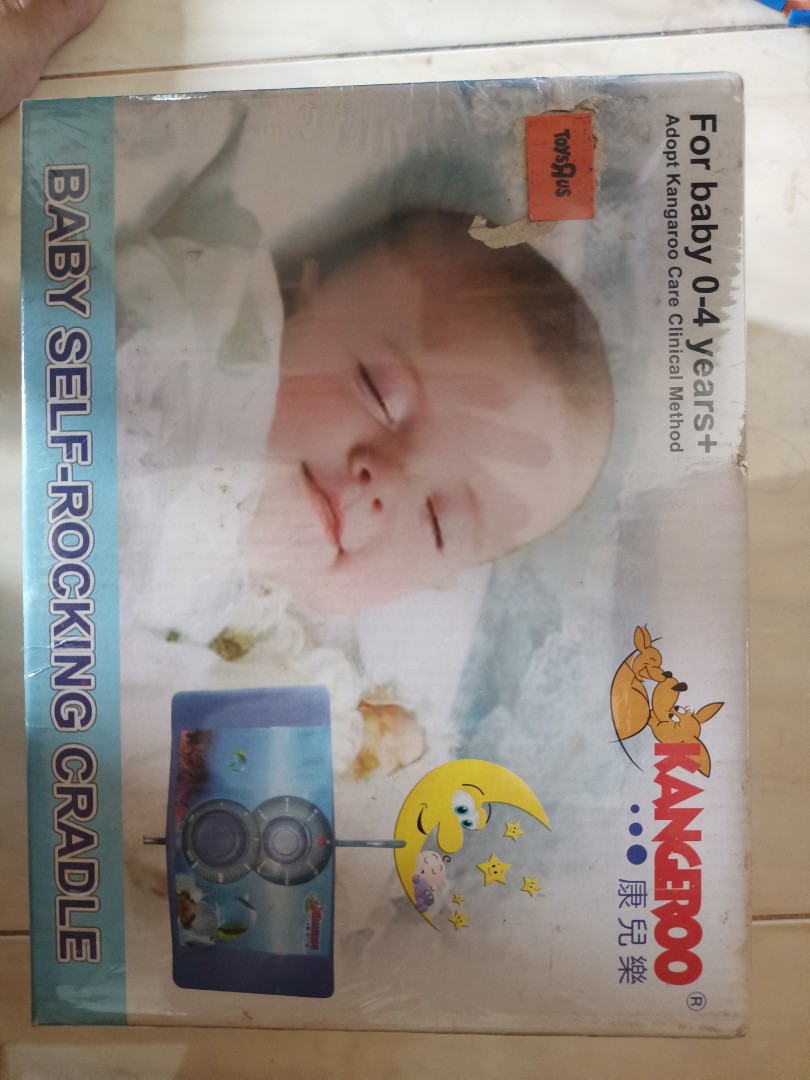 Self top rocking cradle