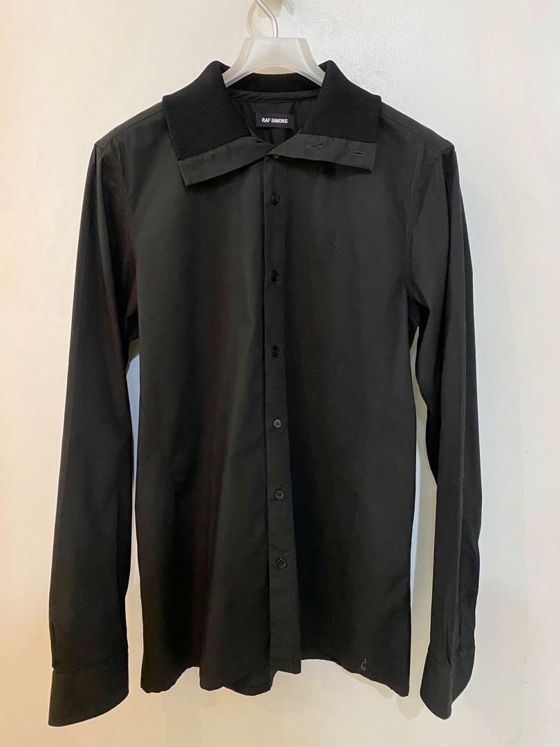Raf Simons Long Sleeves Shirt (Category: Formal Shirts) located in Pasig City. Submitted by capsulecollection (Listing ID 1164440095, Image 1). Description: Raf Simons black long sleeves shirt with 3-way collar. .