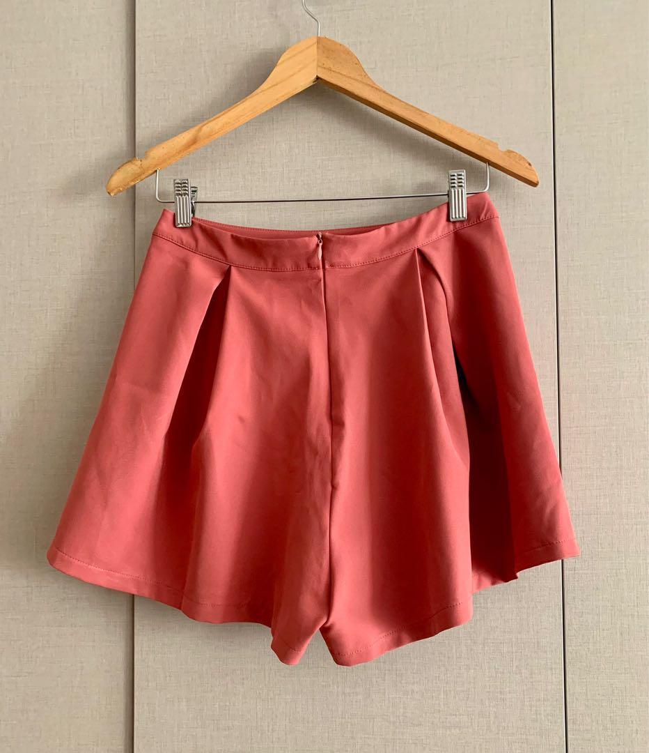Rust dainty shorts (Category: Shorts) located in Mandaluyong City. Submitted by declutterila (Listing ID 1164450919, Image 2). Description: Rust colored shorts from something borrowed. Material is slightly stretchy and looks almost like a miniskirt when worn. One of my faves but doesn’t fit me anymore :( Fits size s-medium best.