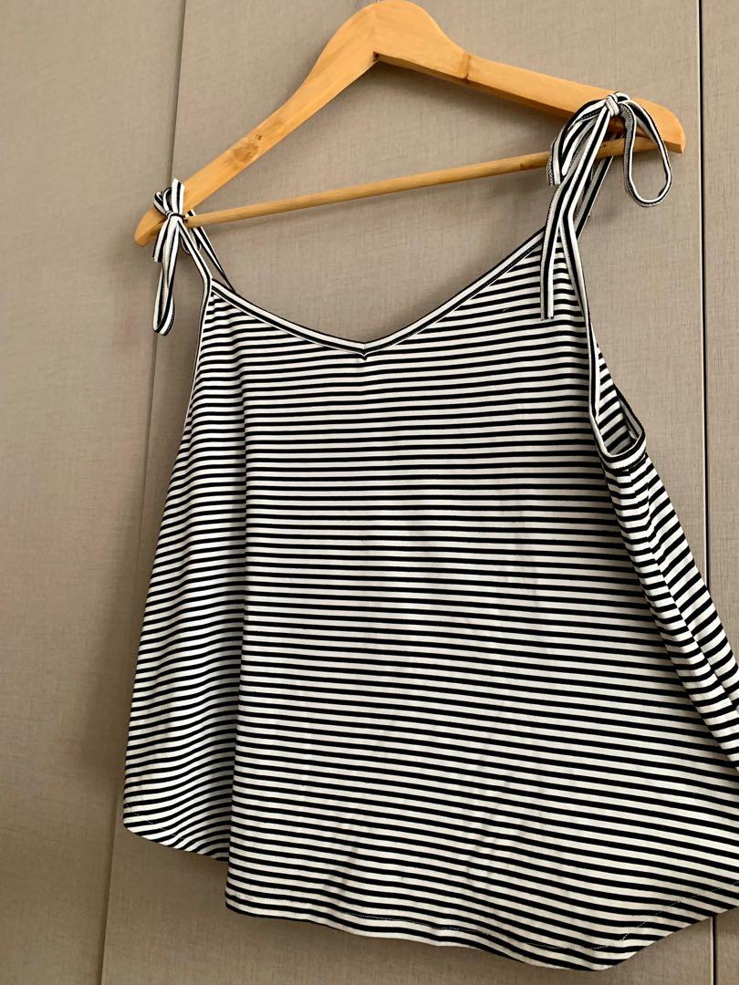 Striped shoulder tie top (Category: Sleeveless) located in Mandaluyong City. Submitted by declutterila (Listing ID 1164453941, Image 3). Description: Zalora striped shoulder tie blouse. Material is stretchy and super breezy. Very flattering when worn. Selling cause it doesn’t fit me anymore No flaws. .
