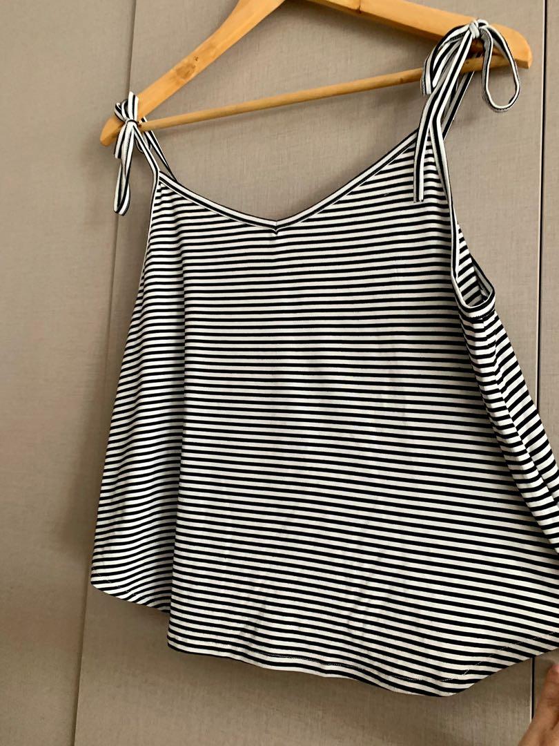 Striped shoulder tie top (Category: Sleeveless) located in Mandaluyong City. Submitted by declutterila (Listing ID 1164453941, Image 2). Description: Zalora striped shoulder tie blouse. Material is stretchy and super breezy. Very flattering when worn. Selling cause it doesn’t fit me anymore No flaws. .