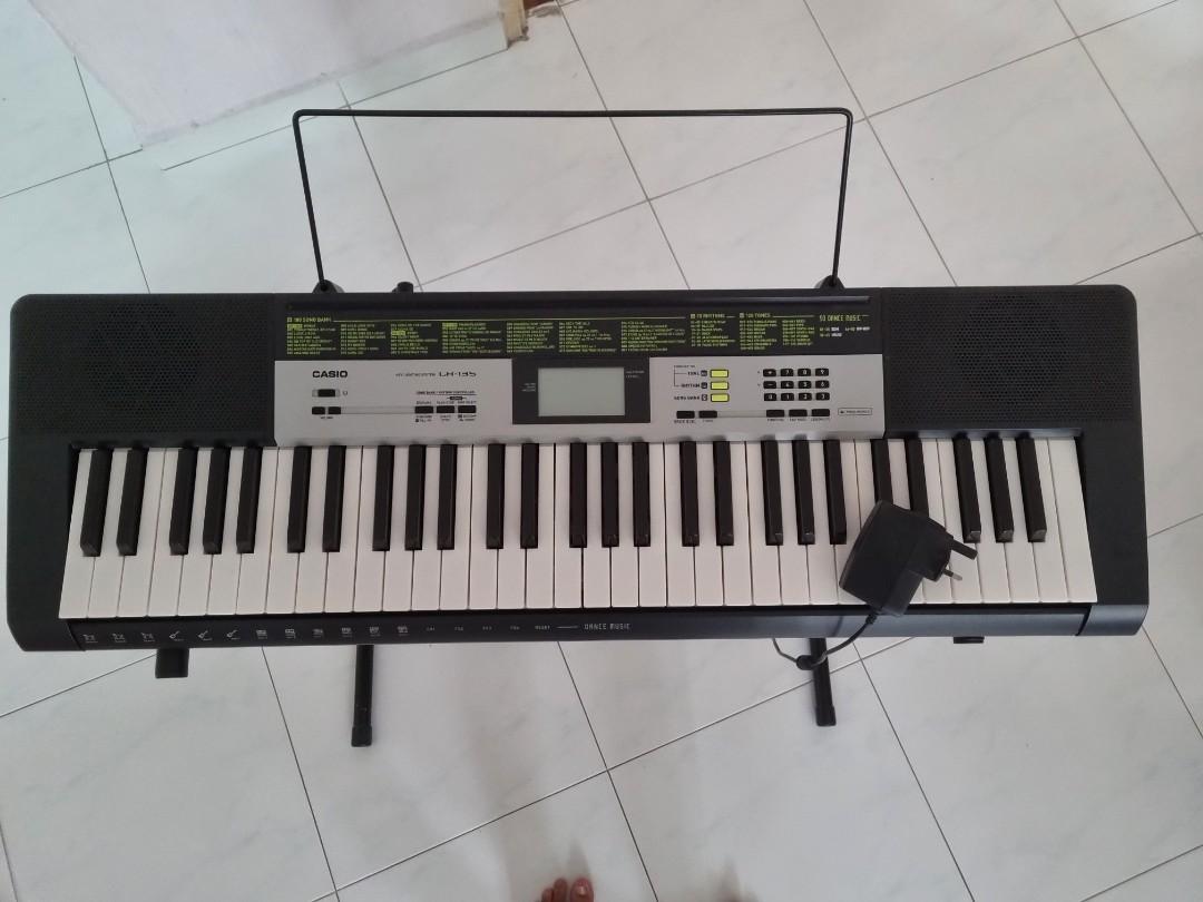 Lk 135 Casio piano with piano stand and key lights Hobbies Toys