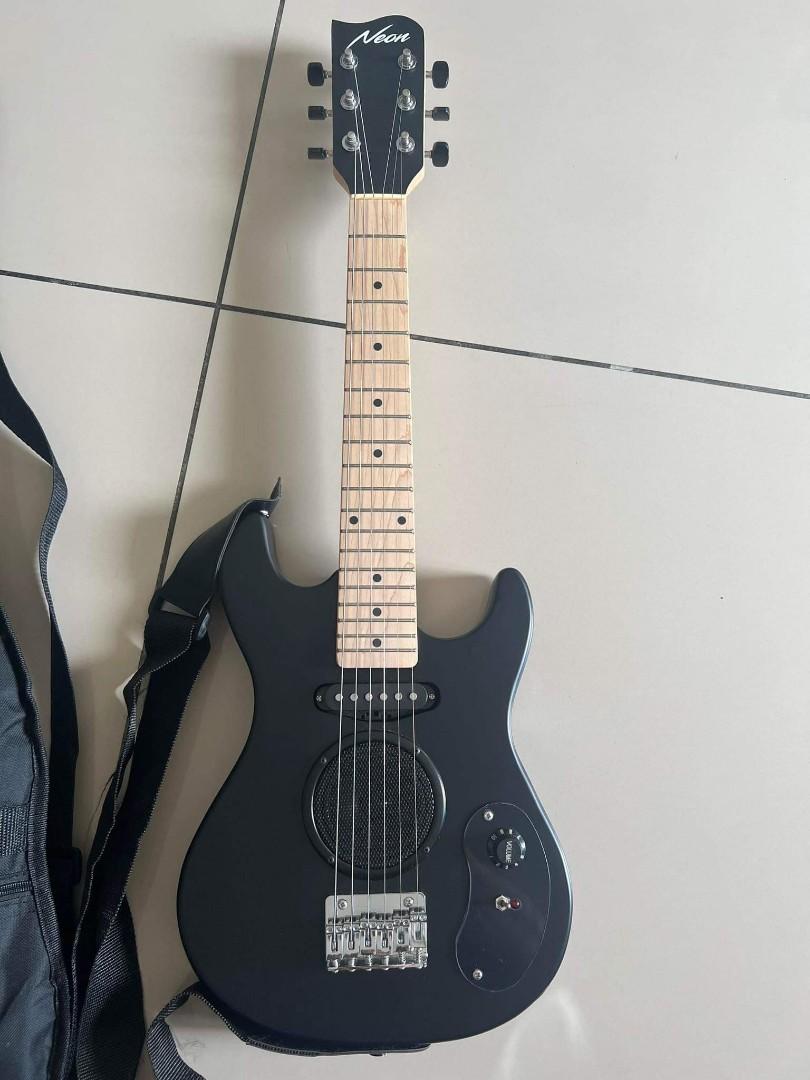Mini guitar built in cheap speaker