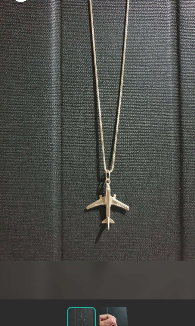 Silver works airplane pendant