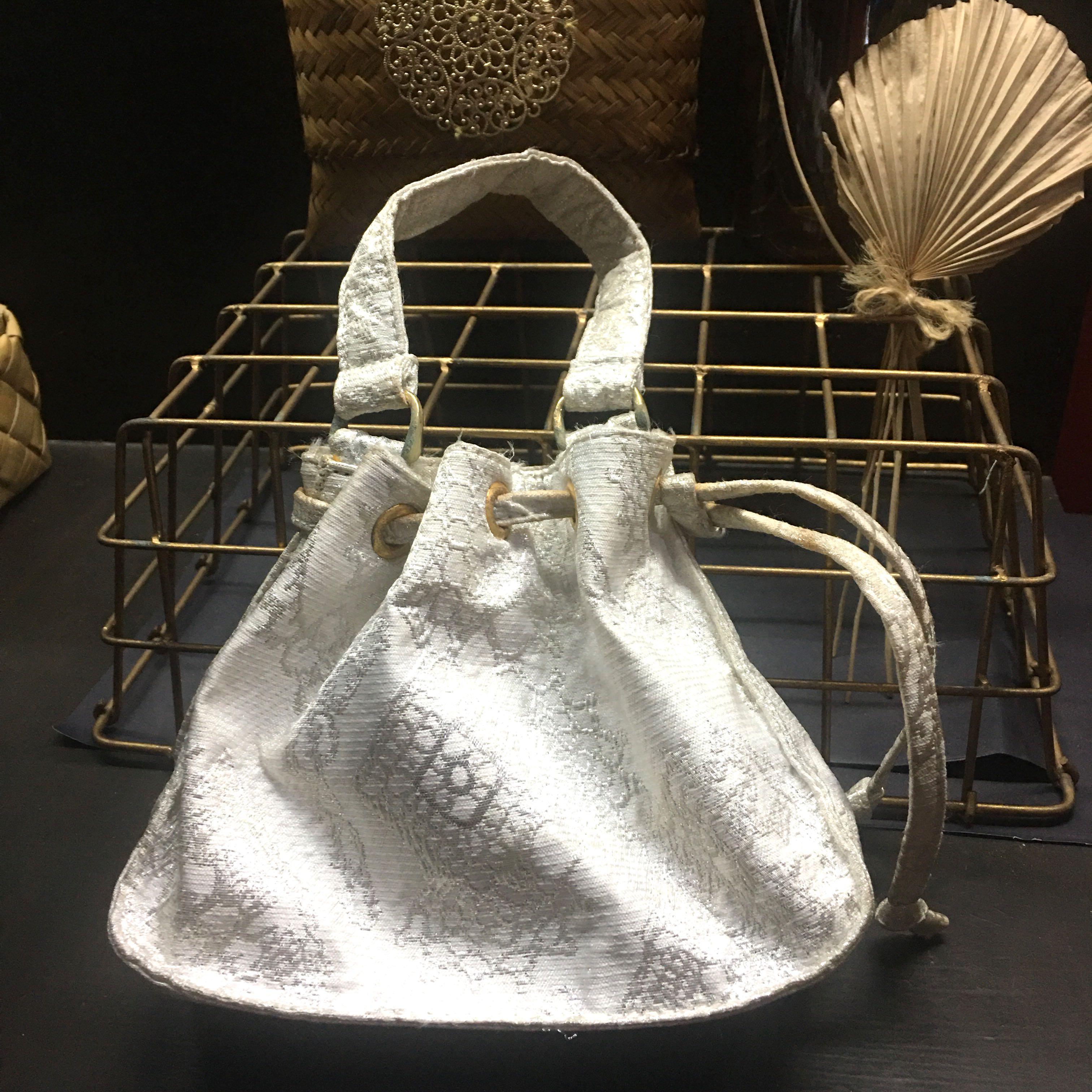 Christian Lacroix Paris Small Bag (Category: Luxury Bags & Wallets) located in Manila. Submitted by coolandchic (Listing ID 1165570459, Image 1). Description: From Paris Drawstring Small size Has slight mark from storage .