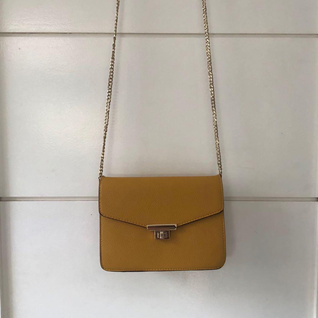 Mango mustard yellow solid sling bag shop