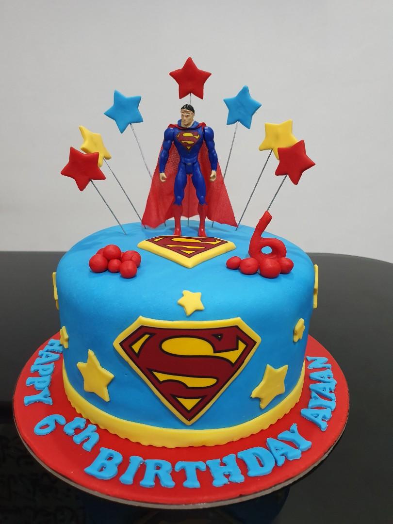 Superman Bursting Out of the Birthday Cake