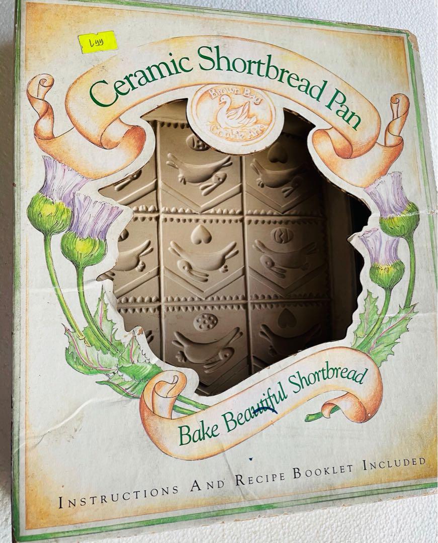 Shortbread Cookie Mold Pan (Category: Bakeware) located in Paranaque City. Submitted by paw_prints9 (Listing ID 1171813950, Image 3). Description: Vintage 1993 ceramic shortbread cookie pan Bunny and egg design 10.5 x 2 x 12 inches Not used, but stored many years Pan has no issues; in very good condition Includes a mini recipe book (some pages with insect holes) Box is intact but some discoloration .