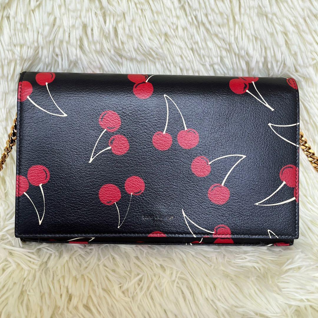 YSL Cherry WoC Limited Edition (Category: Luxury Bags & Wallets) located in Las Pinas. Submitted by Le.Pattie.Luxe (Listing ID 1171718588, Image 2). Description: Limited Edition 🍒 YSL Cherry Wallet on Chain (WoC) 🖤Php 45k🖤 ▪️Super nice in actual ▪️Excellent condition, no scratch, no corner wears, cherry prints not faded. Front YSL logo slightly faded (see photos). ▪️Not your ordinary WoC—apart fr its very chic & limited ed Cherry prints, the s