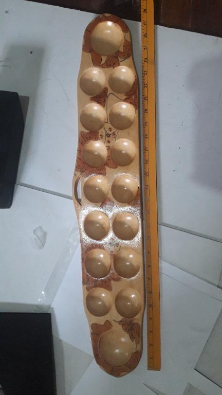 Sungka Board (Category: Vintage Collectibles) located in Quezon City. Submitted by nekorinechan (Listing ID 1171855923, Image 2). Description: Large: Around 28 inches length 5 pieces - 1 plain brown - 1 plain dark brown - 3 with design Php 250 each Small: Around 21-22 inches length 3 pieces Php 200 each NO SHELL Limited amount of shells. +Php 50 if you want the shells Please message me here or SMS at 09150845098 (text only, please do not call).