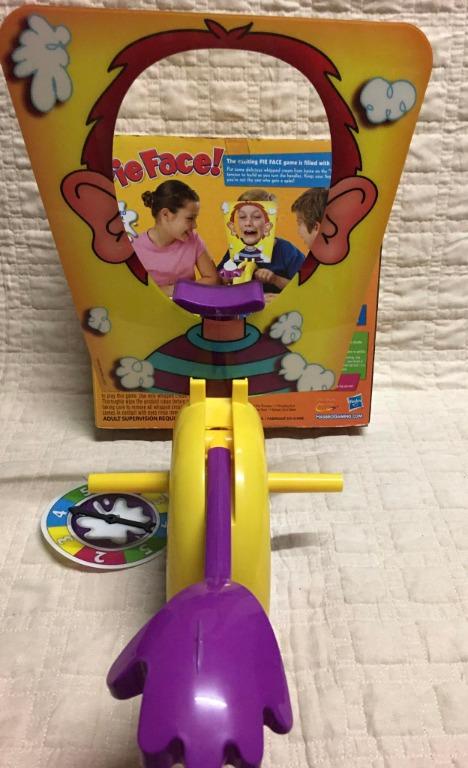 Hasbro Pie Face Board Game (Category: Board Games & Puzzles) located in Taguig. Submitted by Bloomscorner1 (Listing ID 1172150777, Image 3). Description: ✅ Pie face game board - single ✅ contents include: 1 pie thrower, 1 throwing arm, 2 handles, 1 chin rest, 1 splash card mask, 1 spinner ✅ For family and friends fun games.