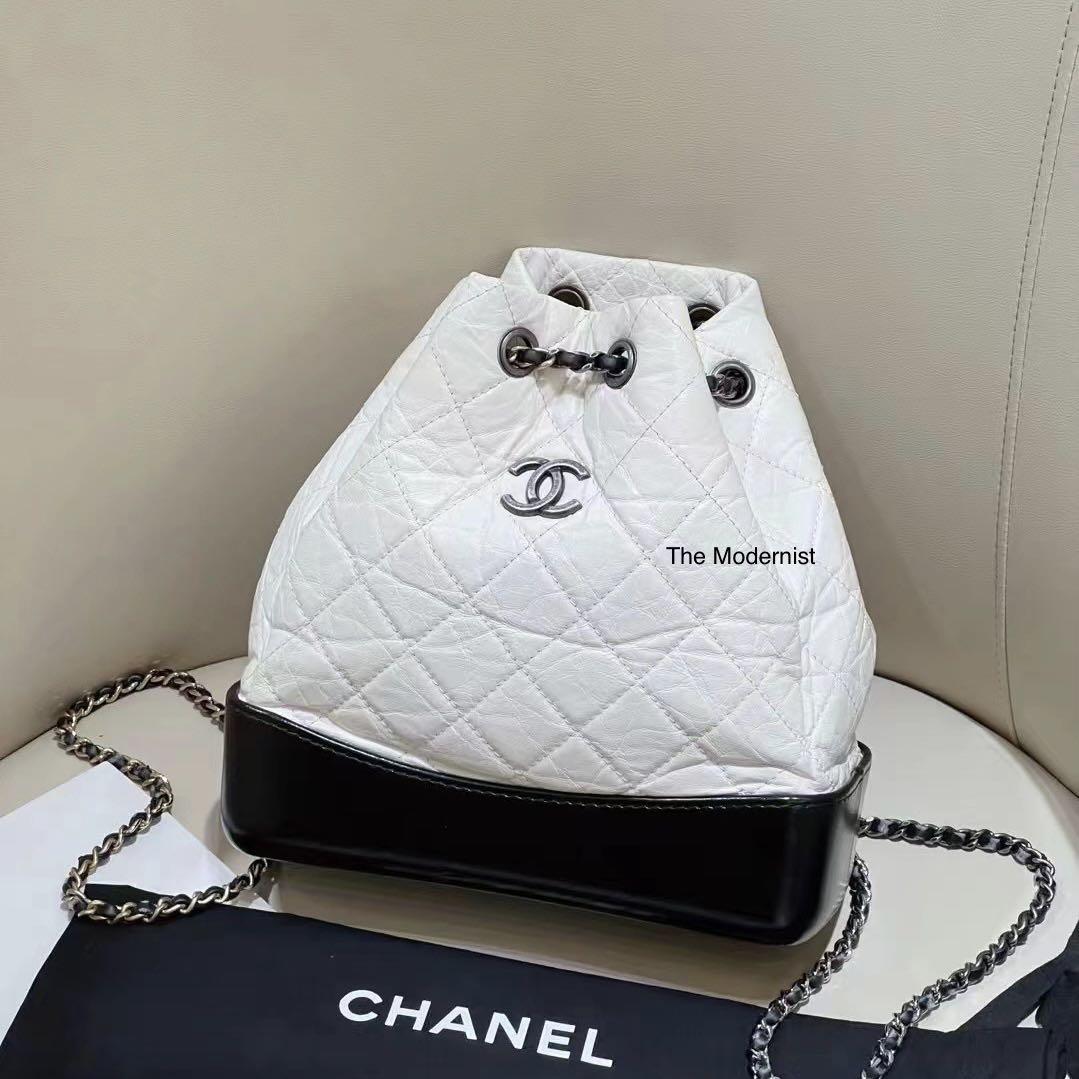 bag chanel gabrielle backpack white pants pants chanel white tshirt  tshirt vest shoes spring outfits  Wheretoget