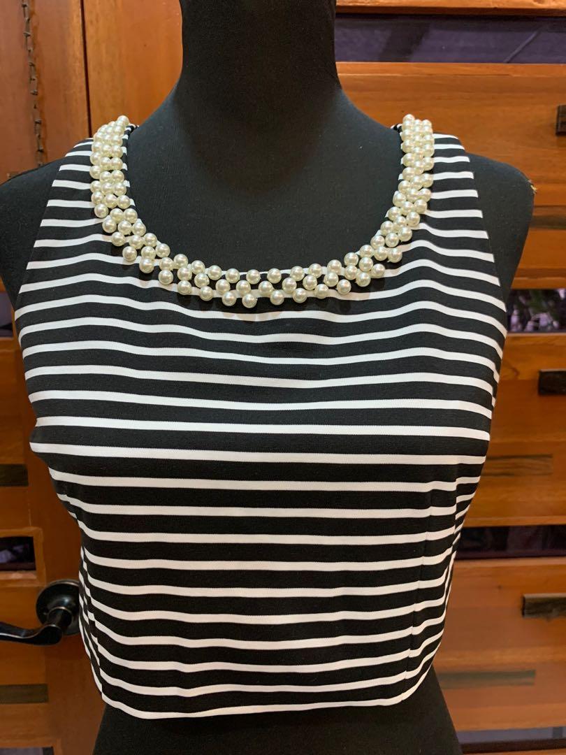 Sleeveless Top with pearl details (Category: Sleeveless) located in Marikina City. Submitted by TheDeclutterDiva (Listing ID 1172291910, Image 1). Description: Sleeveless crop top Bought this in Bangkok Super nice material Pearl details on neckline.
